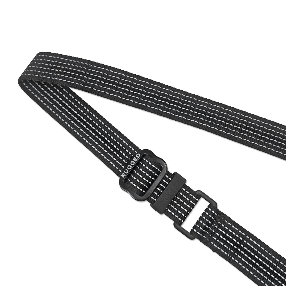 Close-up of black Rugged Dog Company 3-in-1 dog leash showing adjustable-length hardware, Rugged-branded metal slider, heavy-duty 900-lb-rated polyester webbing and high-visibility reflective stitching for increased visibility in low-light conditions
