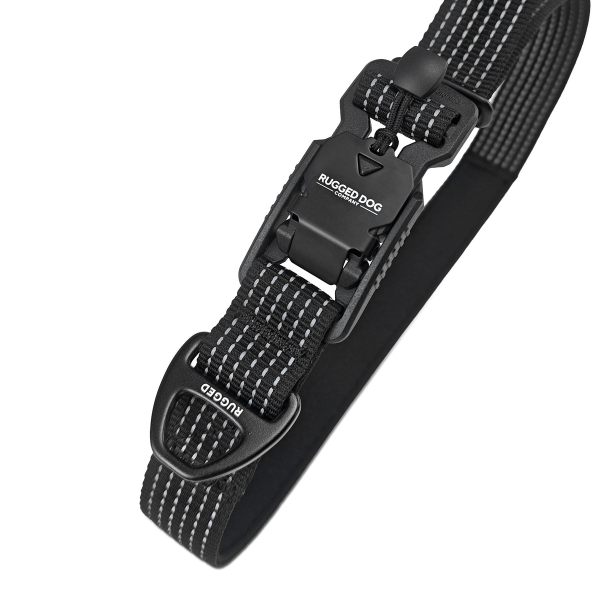 Close-up of black Rugged Dog Company 3-in-1 dog leash showing 500-lb break-strength magnetic FIDLOCK V-Buckle for hand-loop, waist and crossbody conversion, accessory D-ring for poop bags or a water bottle, comfortable padded contact surface, 900-lb-rated polyester webbing and high-visibility reflective stitching