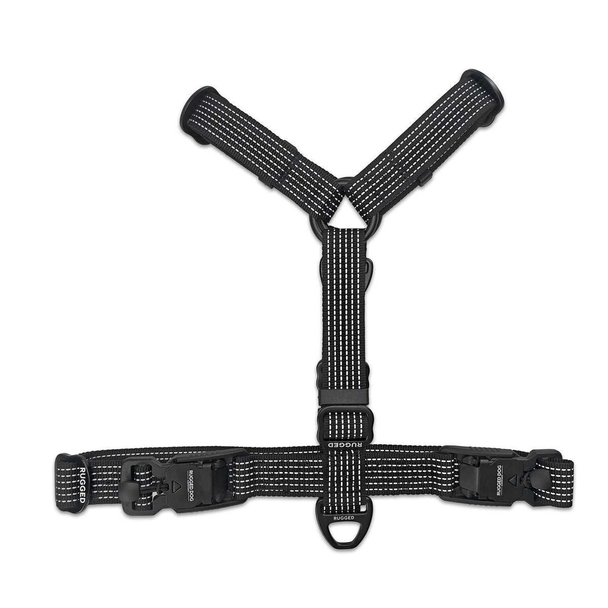 Top view of black Rugged Dog Company no-pull harness showing dual magnetic FIDLOCK V-Buckles, aircraft-grade aluminum back D-ring for standard leash walking, branded metal adjustment sliders and high-visibility reflective polyester webbing