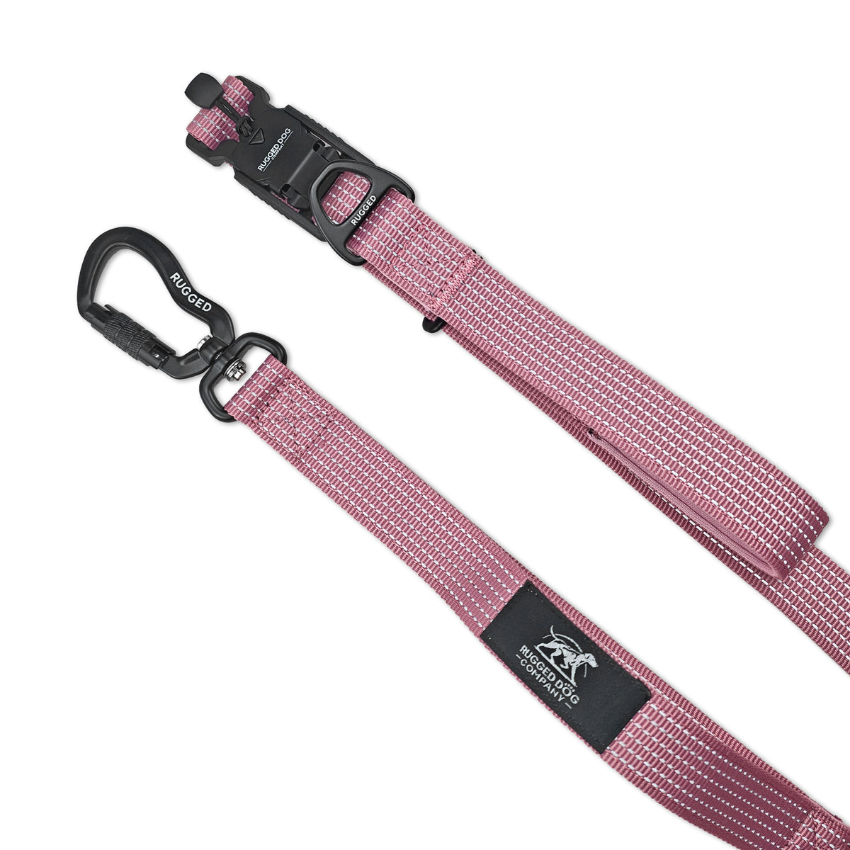 Close-up of Dusty Rose Rugged Dog Company 3-in-1 dog leash showing 885-lb-rated aircraft-grade aluminum auto-locking carabiner with 360-degree swivel, metal connection D-ring, 500-lb break-strength magnetic FIDLOCK V-Buckle, 900-lb-rated polyester webbing and high-visibility reflective stitching
