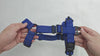Feature demonstration of the Navy Rugged Dog Company no-pull dog harness showing dual magnetic FIDLOCK V-Buckles, high-visibility reflective polyester webbing, aircraft-grade aluminum front and back D-rings, and Rugged-branded metal adjustment sliders